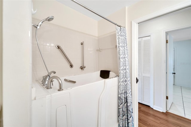 bathroom with wood-type flooring