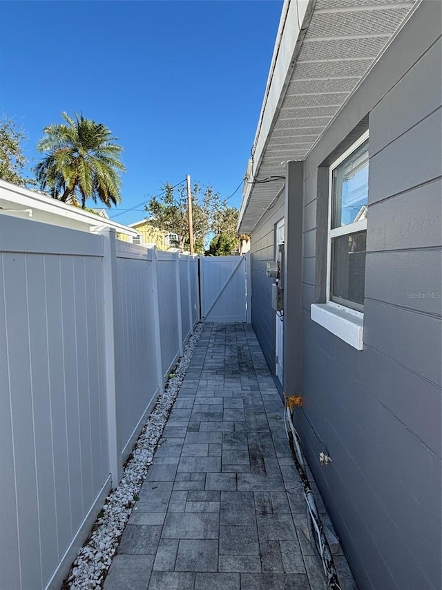 view of side of property with a patio area