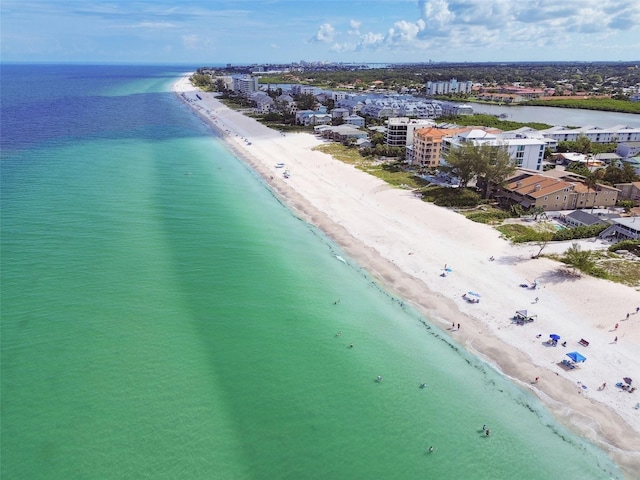 aerial view featuring a view of the beach and a water view