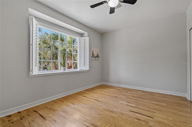 unfurnished room with ceiling fan and light hardwood / wood-style flooring