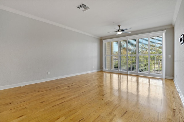 unfurnished room featuring light hardwood / wood-style flooring, ceiling fan, and ornamental molding