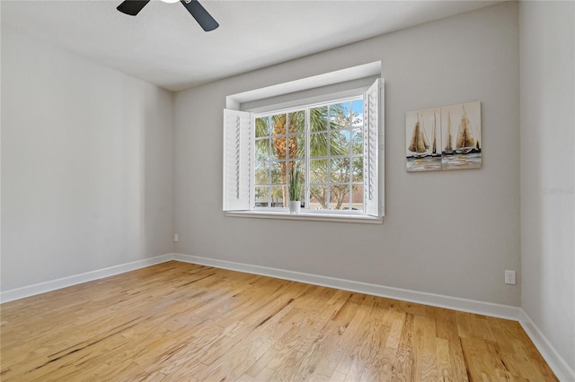 empty room featuring ceiling fan and hardwood / wood-style flooring