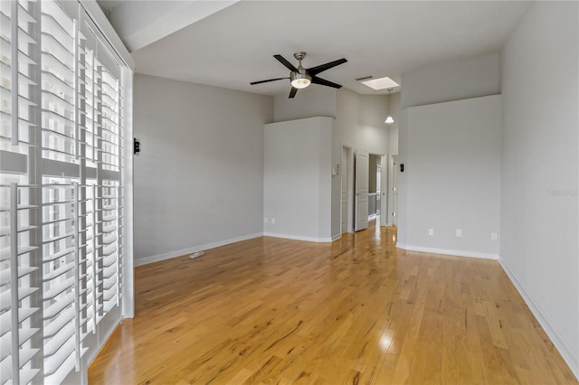 empty room featuring ceiling fan and light wood-type flooring