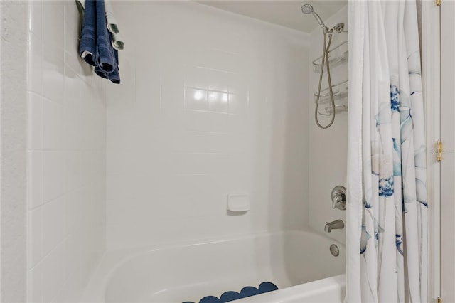 bathroom featuring shower / bath combo with shower curtain