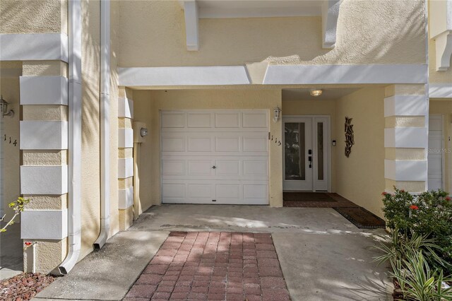 entrance to property featuring a garage