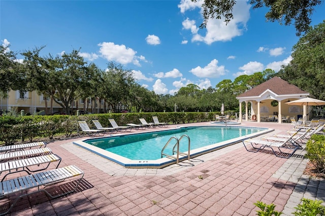 view of swimming pool featuring a patio area