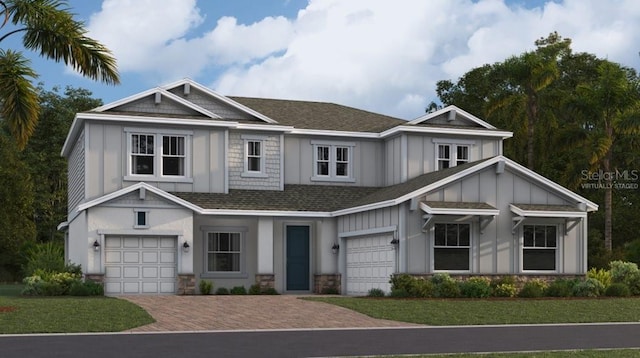 view of front facade featuring a front yard and a garage