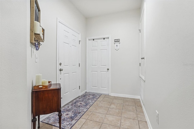 doorway to outside featuring light tile patterned floors