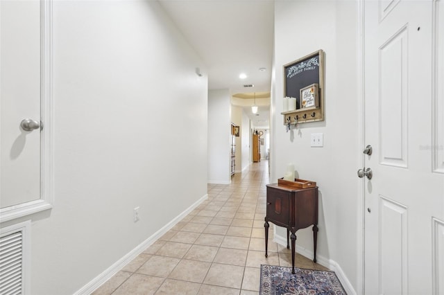 hallway with light tile patterned flooring