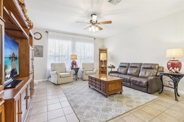 living room featuring ceiling fan and light tile patterned floors