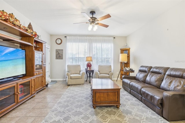 tiled living room with ceiling fan