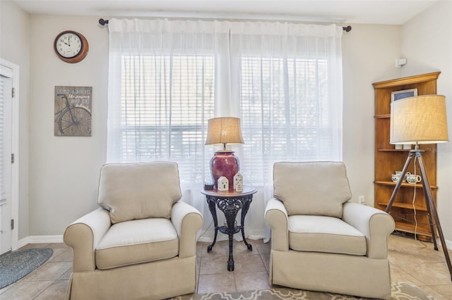 sitting room featuring light tile patterned floors and plenty of natural light