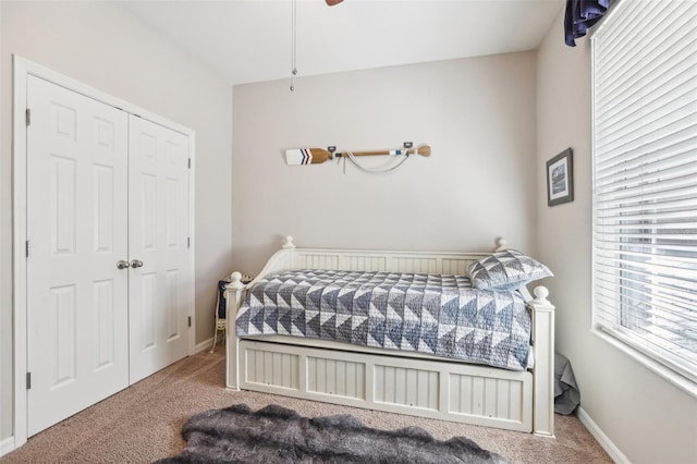 bedroom with carpet floors and a closet