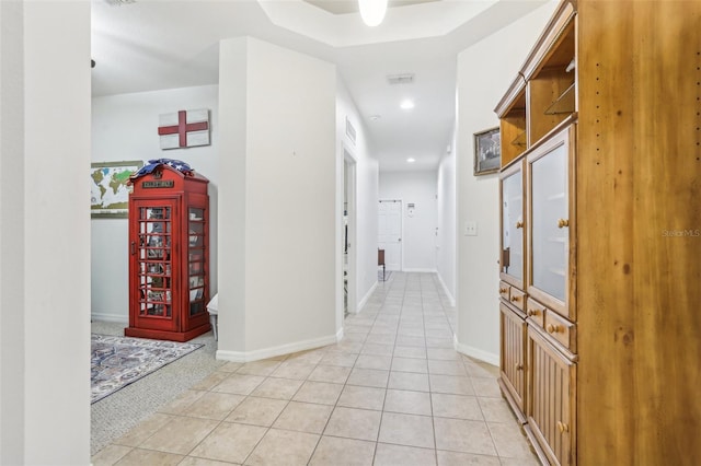 hallway with light tile patterned floors