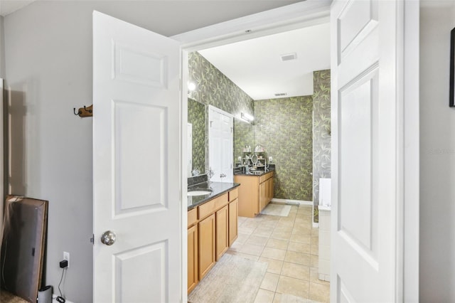 bathroom with tile patterned flooring and vanity