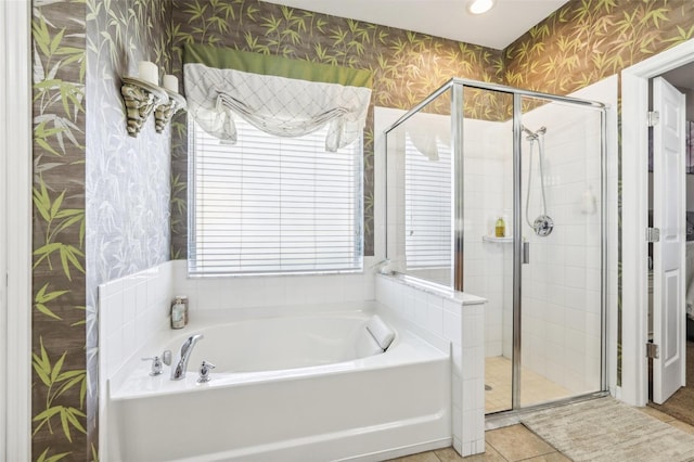 bathroom with tile patterned floors and separate shower and tub