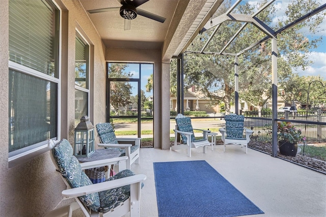 sunroom with vaulted ceiling and ceiling fan