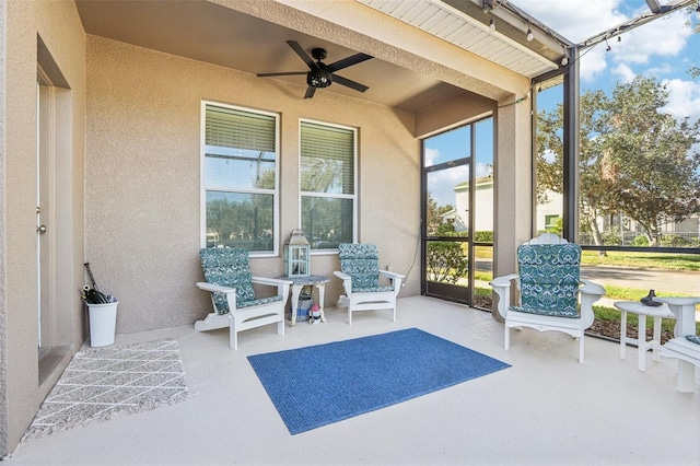 sunroom with ceiling fan and a healthy amount of sunlight