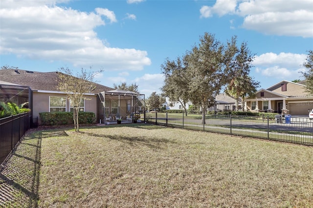 view of yard featuring glass enclosure