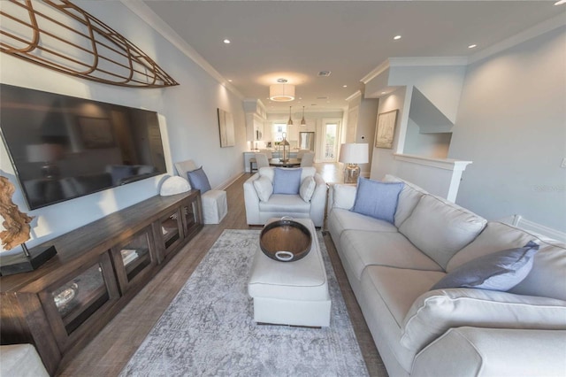 living room featuring ornamental molding and hardwood / wood-style floors