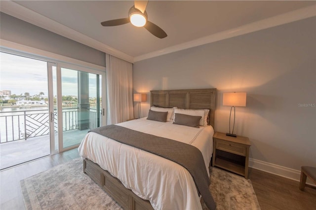 bedroom with hardwood / wood-style flooring, ceiling fan, access to outside, ornamental molding, and a water view