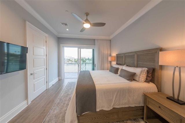 bedroom featuring ceiling fan, wood-type flooring, and access to outside