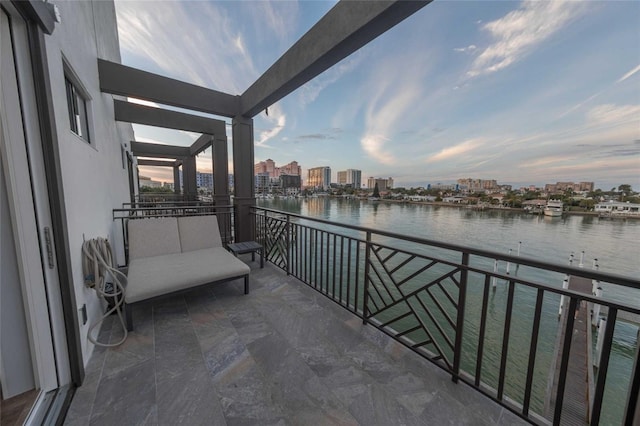 balcony at dusk with a water view