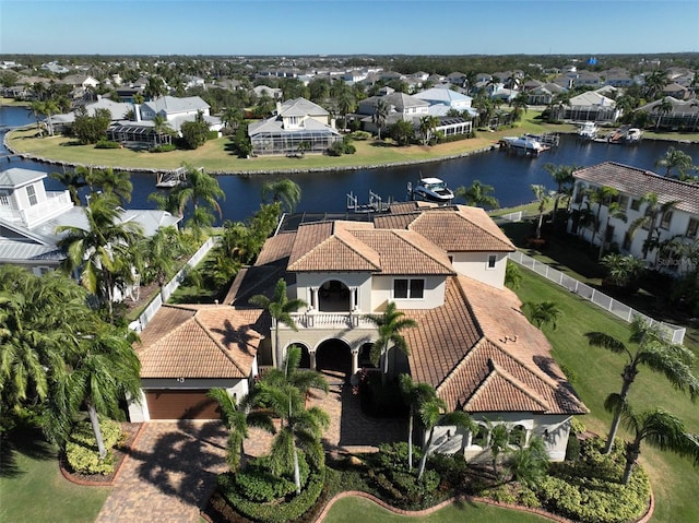 birds eye view of property with a water view