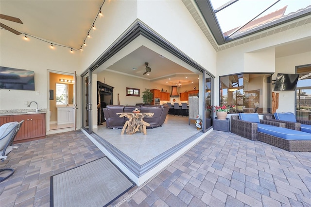 view of patio featuring outdoor lounge area and sink