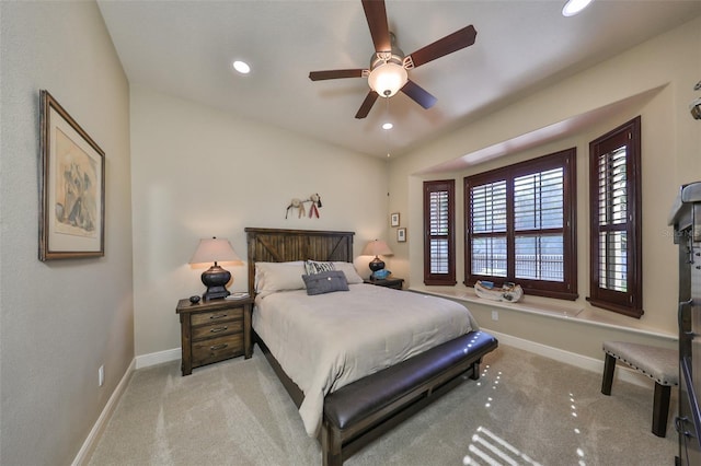 bedroom featuring light carpet and ceiling fan