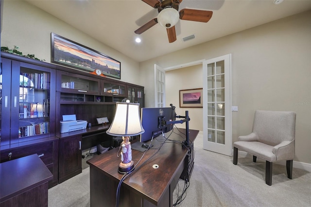 office featuring ceiling fan, light colored carpet, and french doors