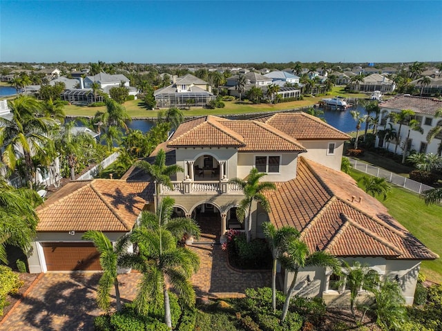 birds eye view of property with a water view