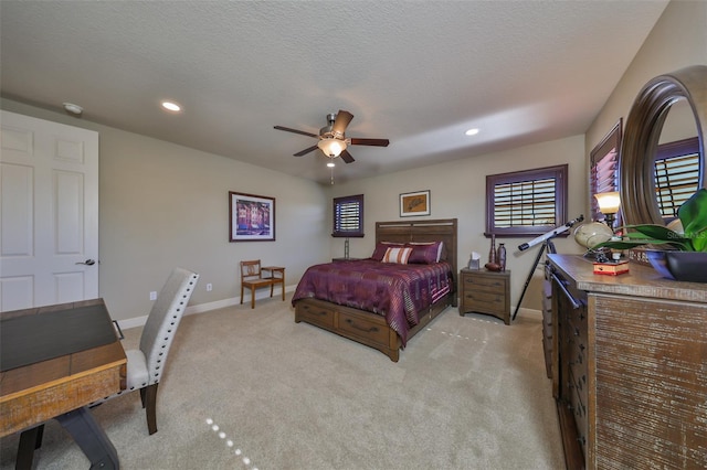 bedroom featuring recessed lighting, light colored carpet, a ceiling fan, a textured ceiling, and baseboards