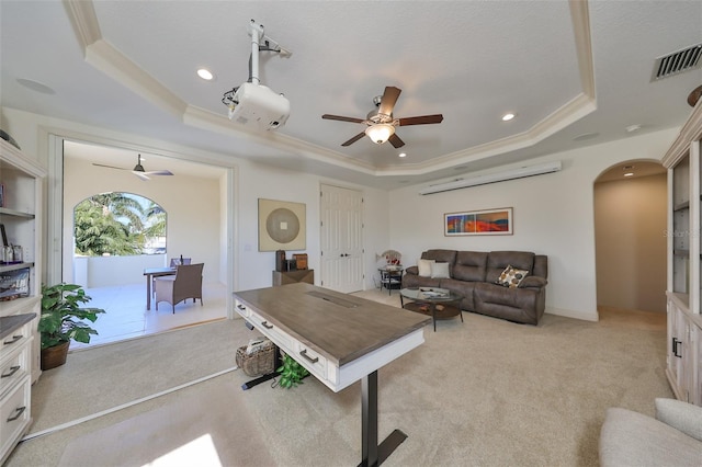 rec room featuring visible vents, a raised ceiling, and light colored carpet