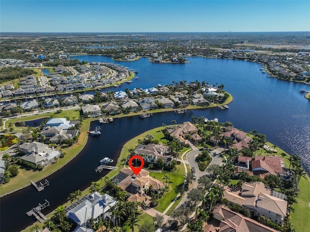 aerial view with a water view and a residential view