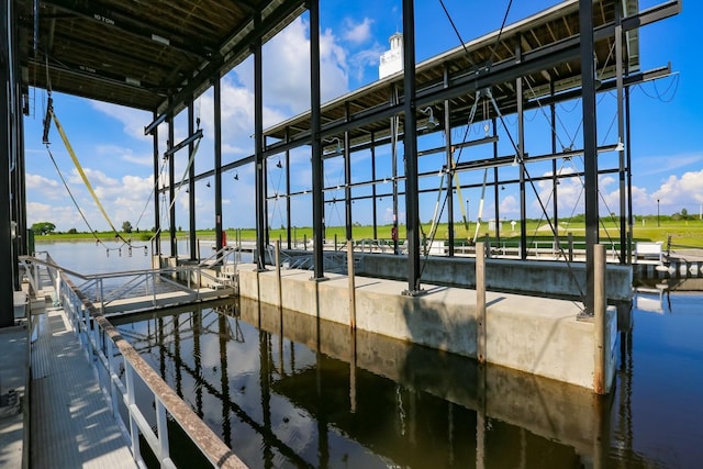 dock area with a water view