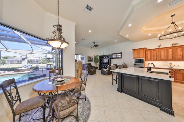 dining area featuring light tile patterned floors, a sunroom, visible vents, and recessed lighting