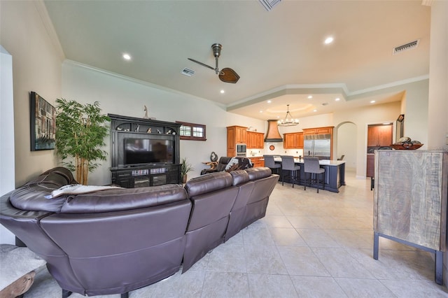 living area featuring light tile patterned flooring, visible vents, crown molding, and recessed lighting