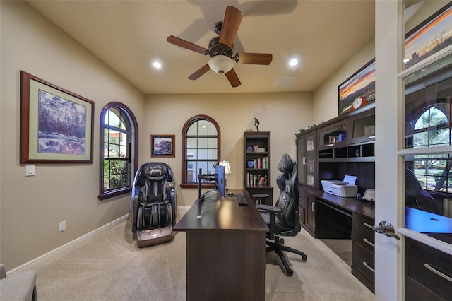 office space with recessed lighting, baseboards, ceiling fan, and light colored carpet