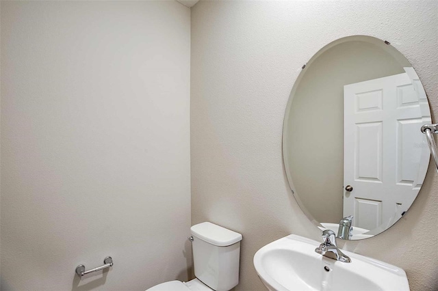 bathroom with sink and toilet