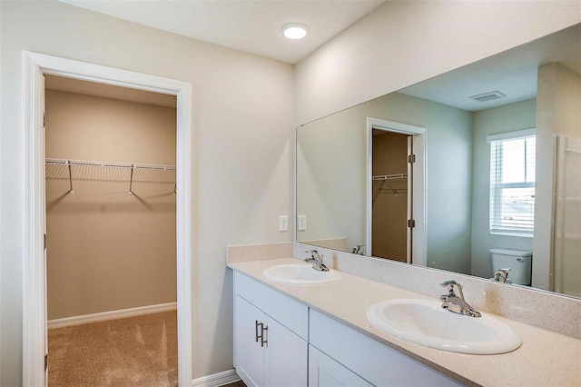 bathroom with vanity and toilet