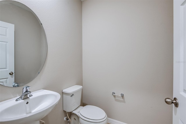 bathroom with sink and toilet