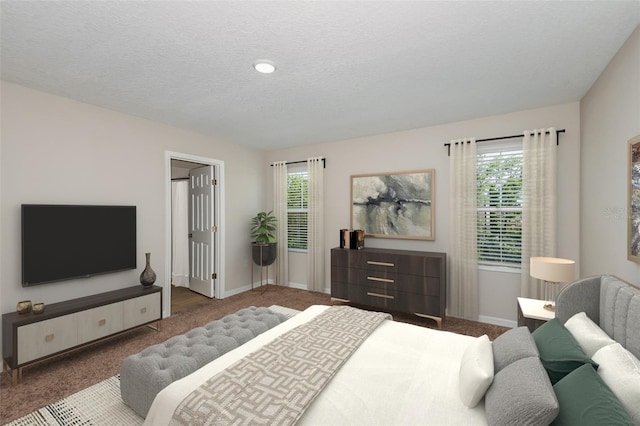 carpeted bedroom featuring a textured ceiling and multiple windows