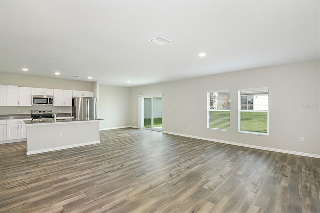 unfurnished living room with hardwood / wood-style floors