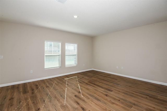 empty room featuring dark hardwood / wood-style floors