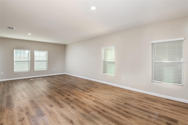 spare room featuring hardwood / wood-style floors