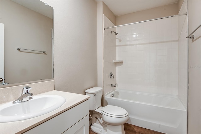 full bathroom with hardwood / wood-style flooring, vanity, toilet, and tub / shower combination