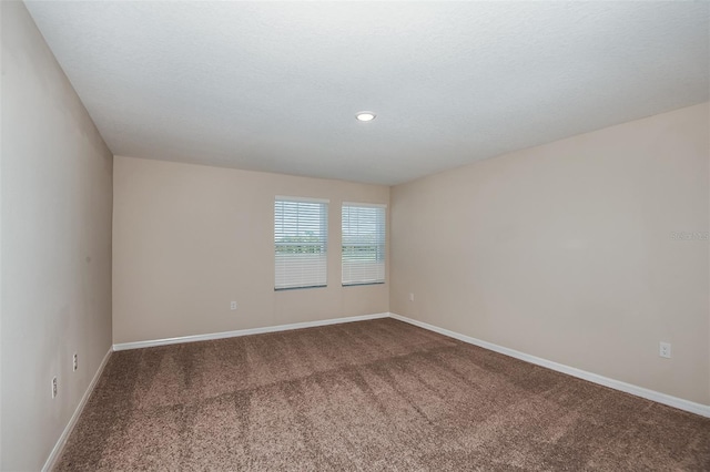 spare room featuring carpet