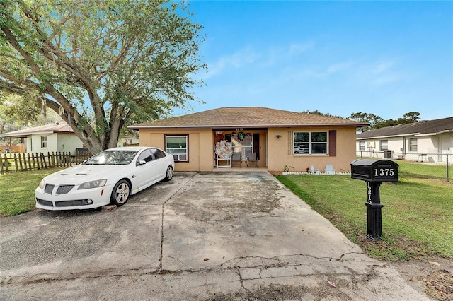 single story home featuring a front yard