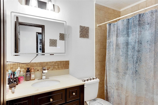 bathroom featuring vanity, curtained shower, and toilet